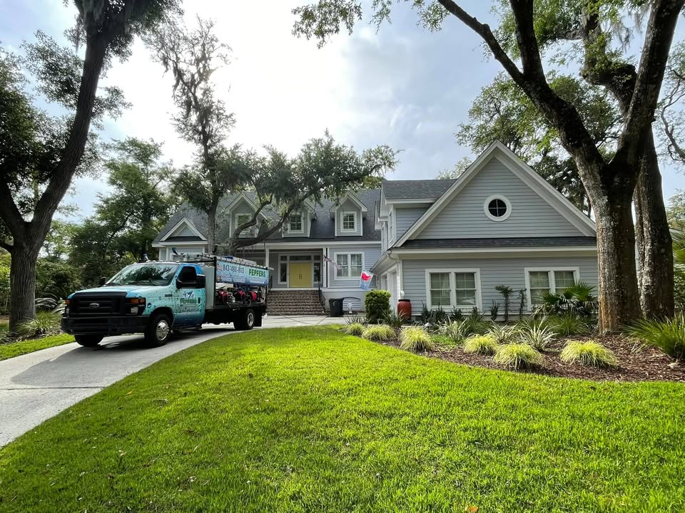 Peppers Pressure Washing and Window Cleaning crew soft washing a Lowcountry home