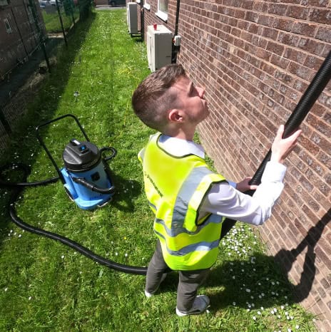 Post-storm gutter cleaning in Charleston with debris removal and downspout flush